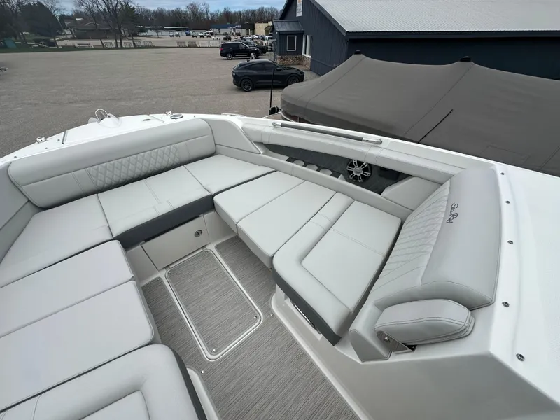 Slide: The Image of Luxurious seating area on 2025 Sea Ray SLX 350 boat, featuring elegant white upholstery. - 6