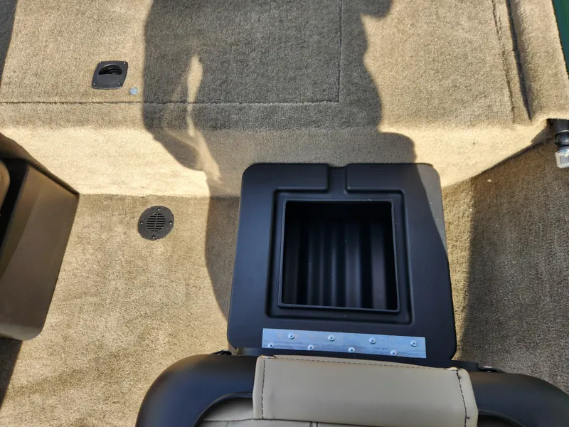 Slide: The Image of 2025 Tracker Bass Tracker Classic XL Limited boat interior with storage compartment. - 10