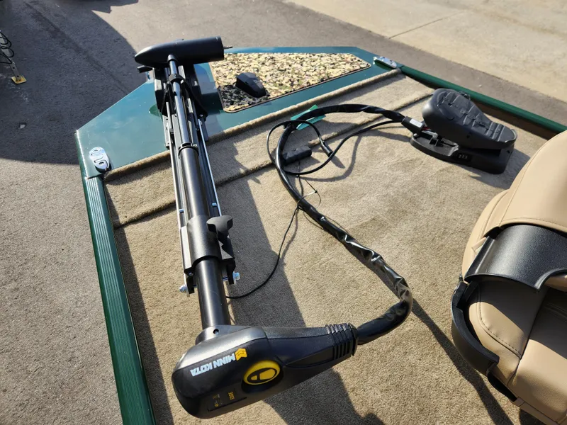 Slide: The Image of 2025 Tracker Bass Tracker Classic XL Limited boat deck with trolling motor. - 18