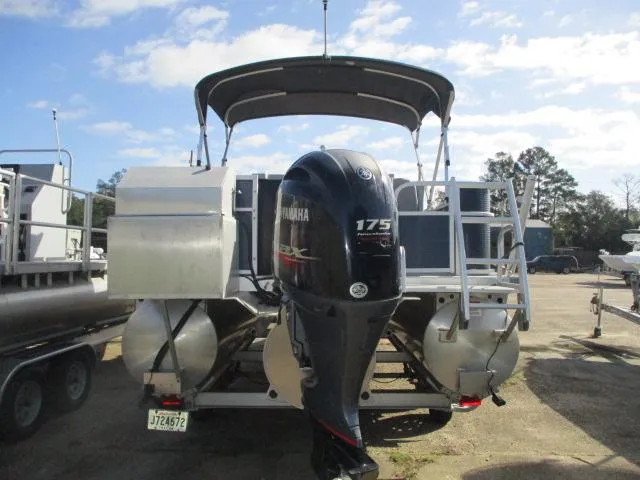 Slide: The Image of 2020 Bennington SFX22 pontoon boat with Yamaha 175 engine, parked outdoors. - 6
