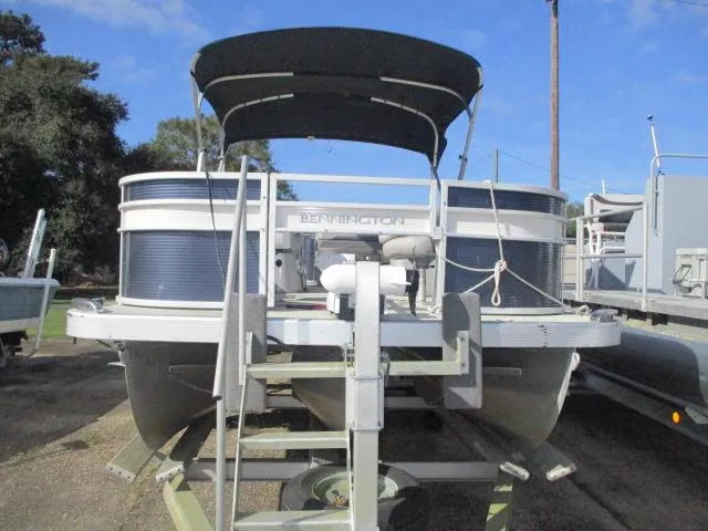 Slide: The Image of 2020 Bennington SFX22 pontoon boat on trailer, outdoor setting. - 8