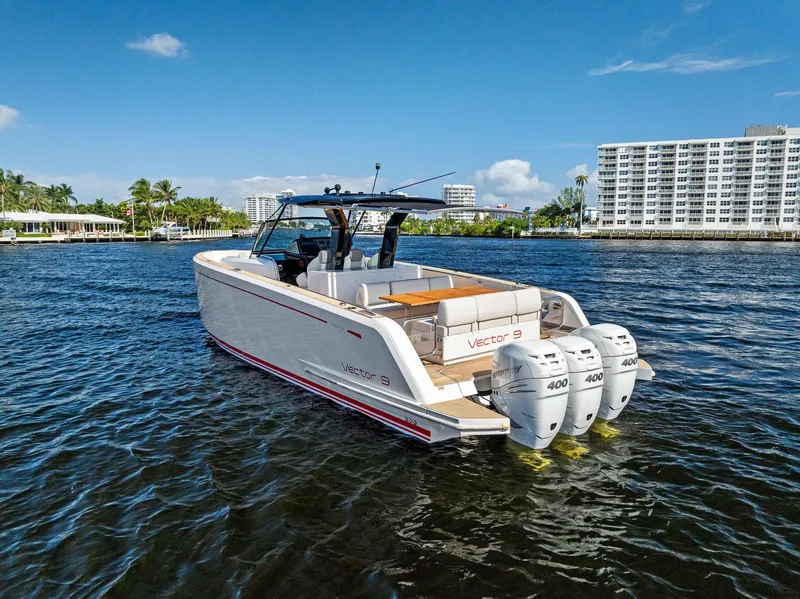 Slide: The Image of Pardo Yachts 38, 2021 model, cruising on a sunny day with triple outboard engines. - 10