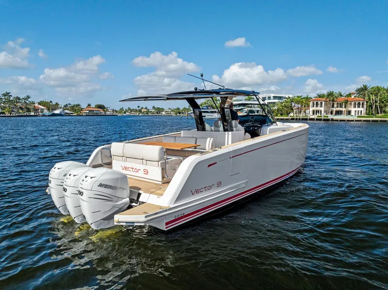 Slide: The Image of 2021 Pardo Yachts 38 cruising on a sunny day, featuring twin outboard engines. - 11