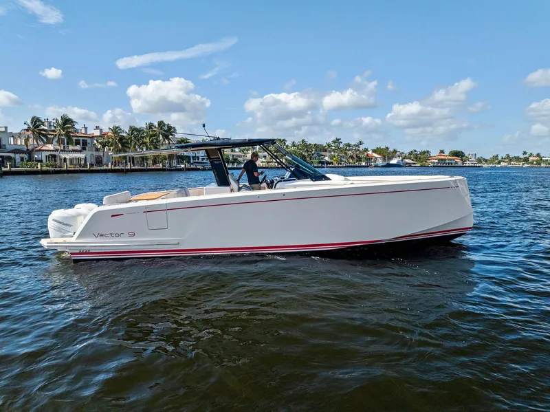 Slide: The Image of 2021 Pardo Yachts 38 cruising on a sunny day, with waterfront homes in the background. - 12