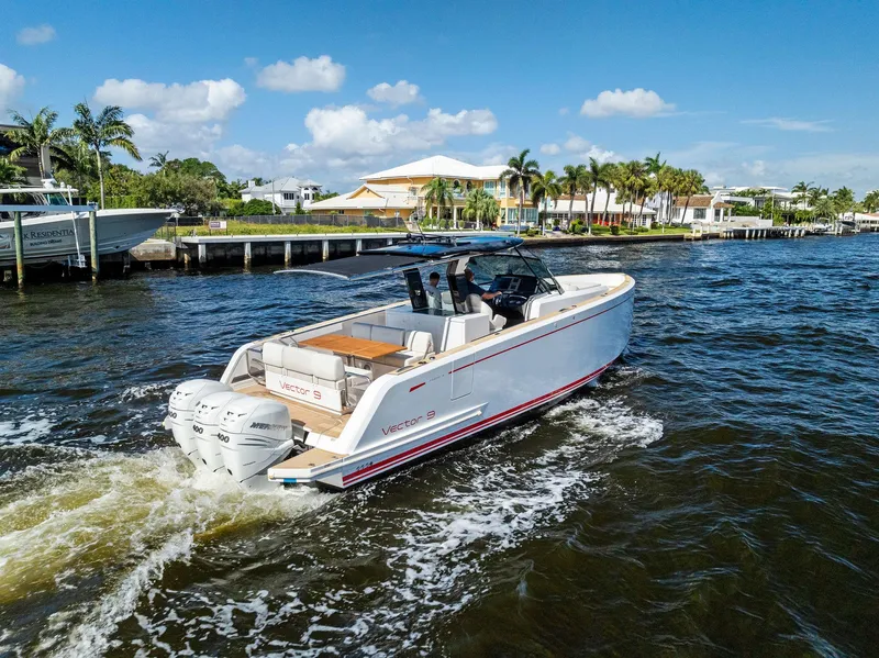 Slide: The Image of 2021 Pardo Yachts 38 cruising on a sunny day near waterfront homes. - 15