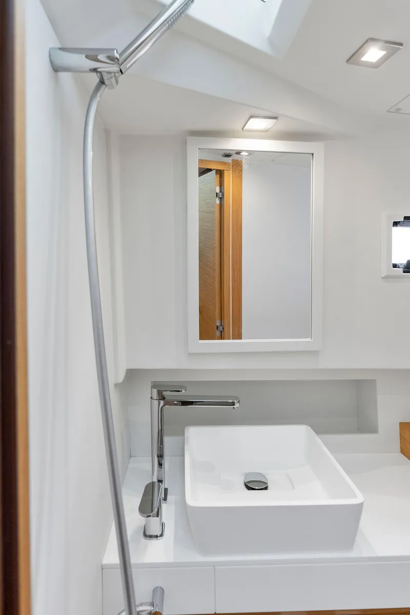 Slide: The Image of Modern bathroom interior on 2021 Pardo Yachts 38, featuring sleek sink and mirror. - 28