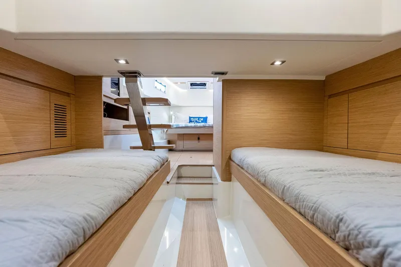 Slide: The Image of Interior cabin of 2021 Pardo Yachts 38 with twin beds and modern wood finish. - 30