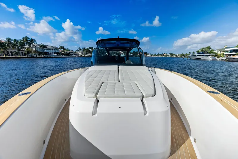 Slide: The Image of 2021 Pardo Yachts 38 on a sunny day, cruising on a scenic waterway. - 34