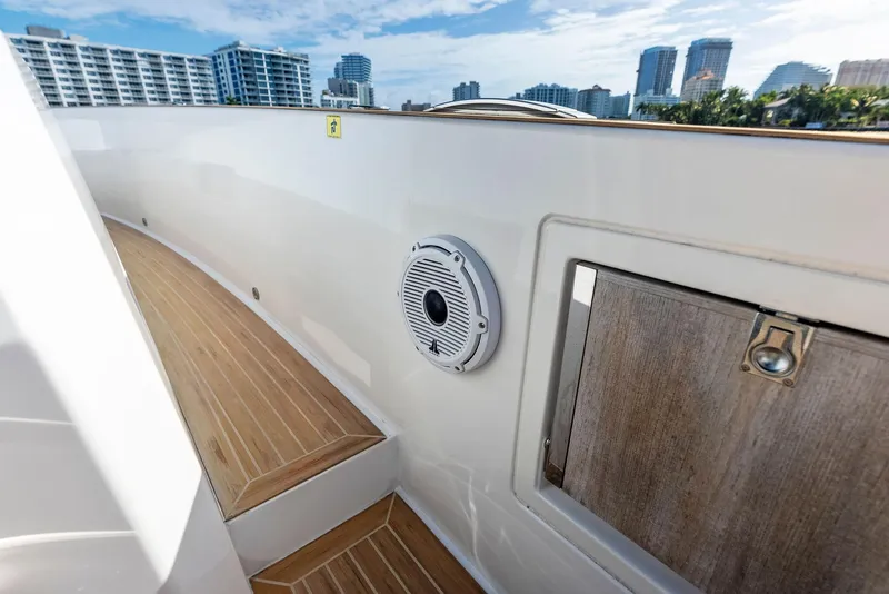 Slide: The Image of Pardo Yachts 38 (2021) deck with speaker and city skyline in background. - 35