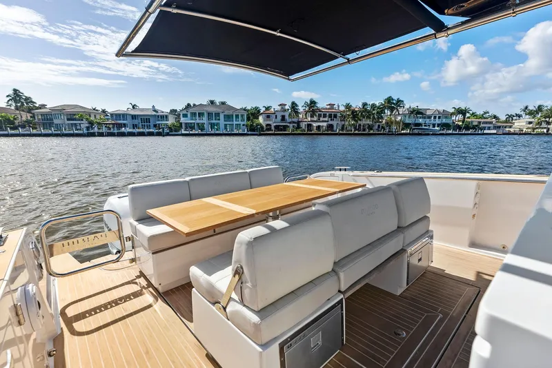 Slide: The Image of Luxury Pardo Yachts 38, 2021 model, with elegant seating and waterfront view. - 37