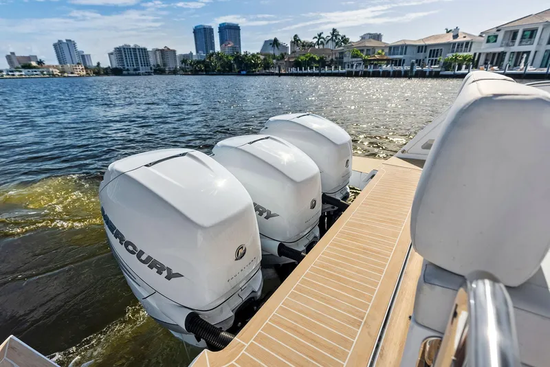 Slide: The Image of Pardo Yachts 38 (2021) with triple Mercury outboard engines on a sunny waterfront. - 39