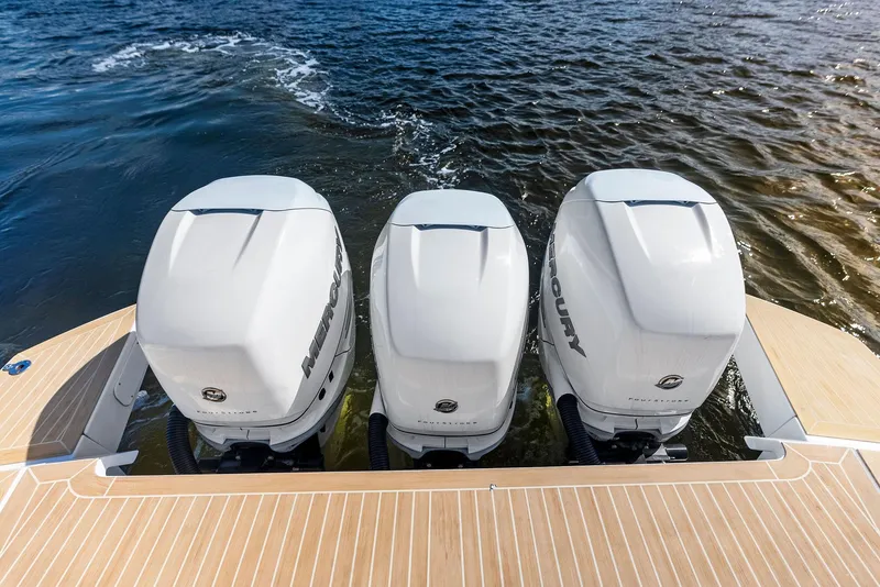 Slide: The Image of Triple Mercury outboard engines on 2021 Pardo Yachts 38, cruising on water. - 40