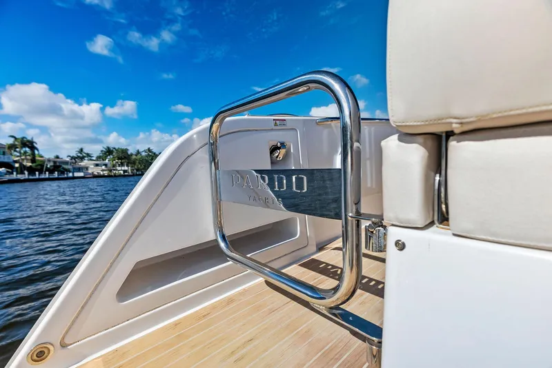 Slide: The Image of Pardo Yachts 38, 2021 model, featuring sleek deck design and chrome details against a blue sky. - 43