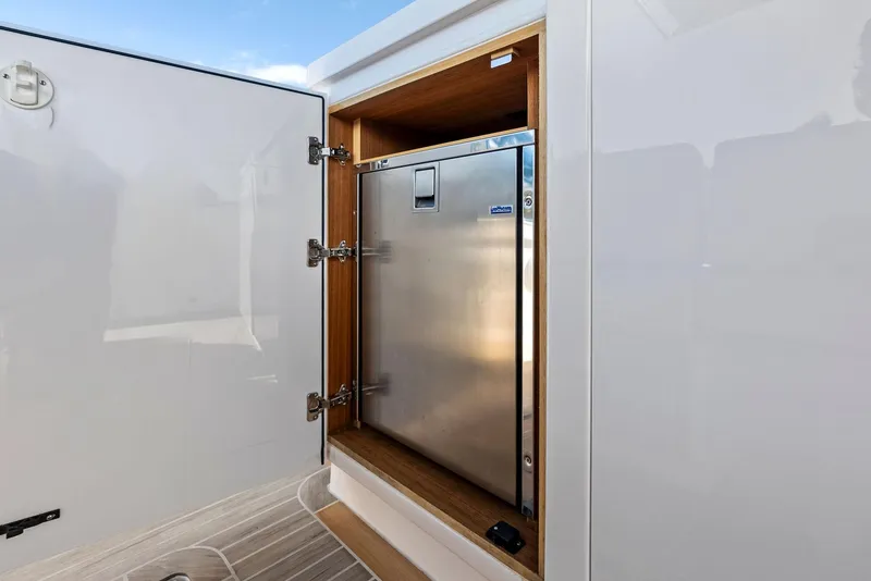 Slide: The Image of Pardo Yachts 38, 2021 model, featuring a built-in stainless steel refrigerator. - 46