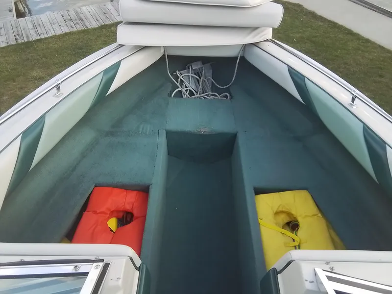 Slide: The Image of 1988 Sea Ray 20 Seville boat interior with life jackets and rope. - 13