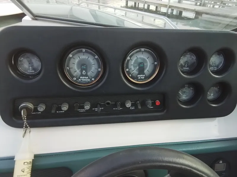 Slide: The Image of Dashboard of 1988 Sea Ray 20 Seville boat with gauges and controls. - 16