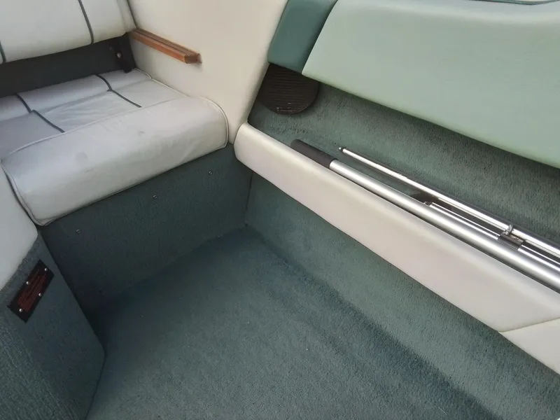 Slide: The Image of Interior of 1988 Sea Ray 20 Seville boat with green and white upholstery. - 23