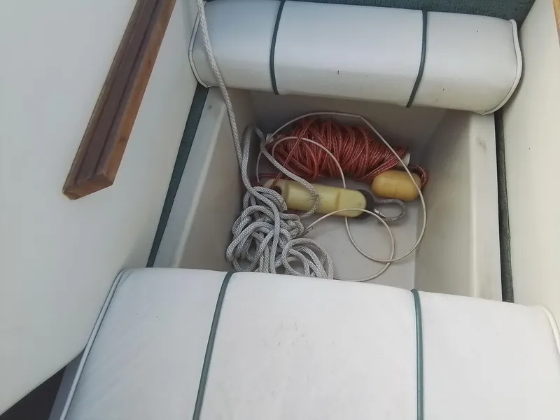 Slide: The Image of 1988 Sea Ray 20 Seville boat storage with ropes and buoys. - 27