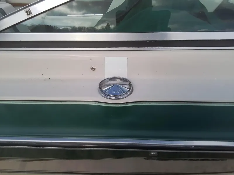 Slide: The Image of 1988 Sea Ray 20 Seville boat side view with logo detail. - 6