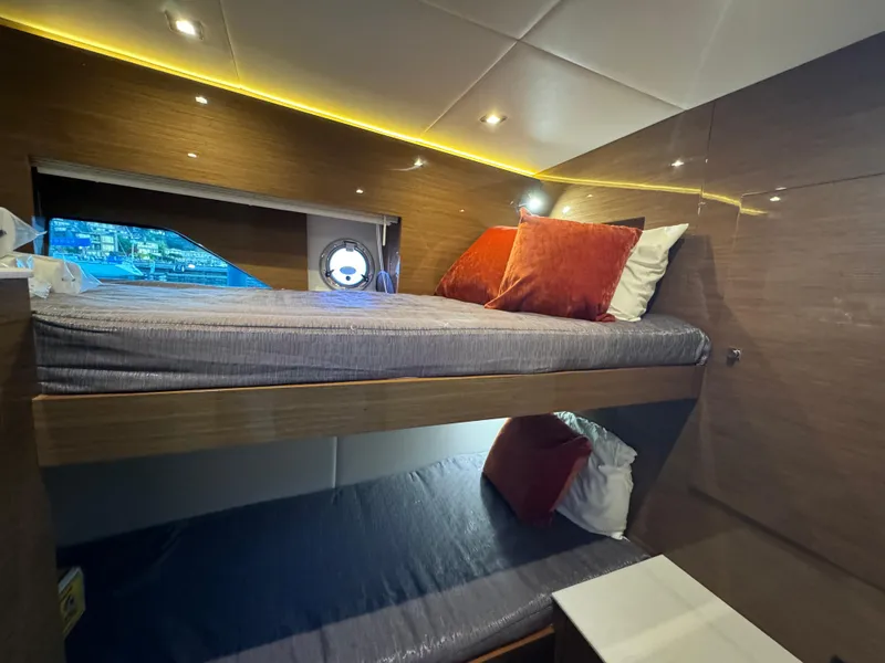Slide: The Image of Interior of 2018 Cruisers Yachts 50 Cantius with cozy bunk beds and modern lighting. - 14