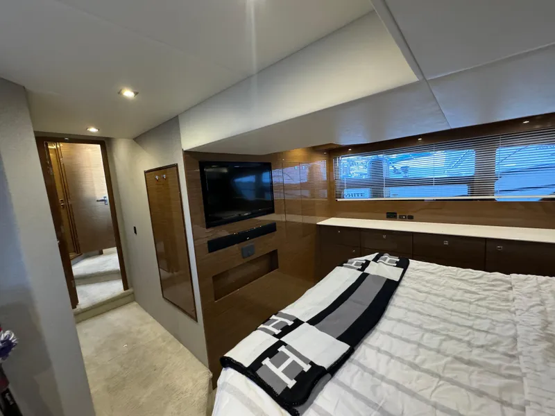 Slide: The Image of Luxurious interior of 2018 Cruisers Yachts 50 Cantius with modern bedroom and TV. - 22