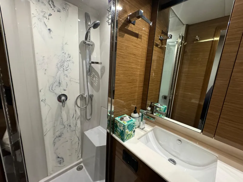 Slide: The Image of Luxurious bathroom in 2018 Cruisers Yachts 50 Cantius with modern shower and sink. - 24