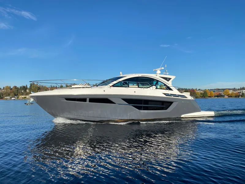 Slide: The Image of 2018 Cruisers Yachts 50 Cantius cruising on a clear blue lake. - 5