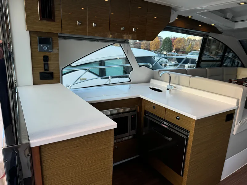 Slide: The Image of Luxurious 2018 Cruisers Yachts 50 Cantius kitchen with modern appliances and sleek design. - 8