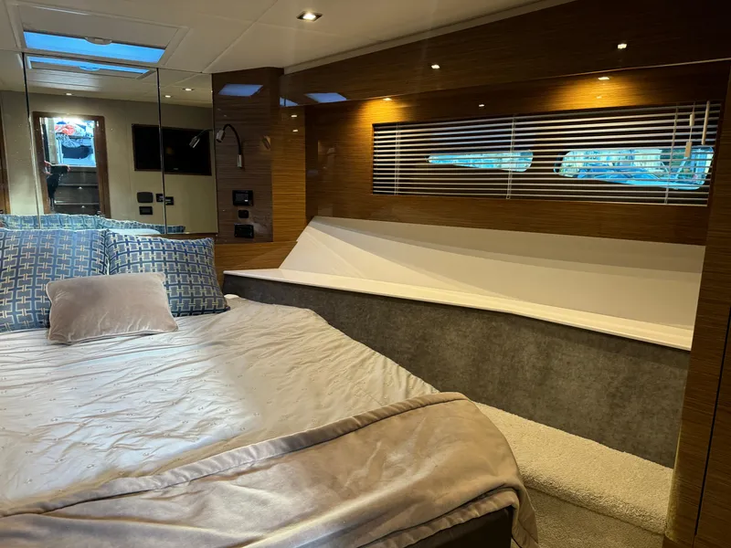 Slide: The Image of Luxurious 2018 Cruisers Yachts 50 Cantius bedroom interior with modern design and cozy bedding. - 16
