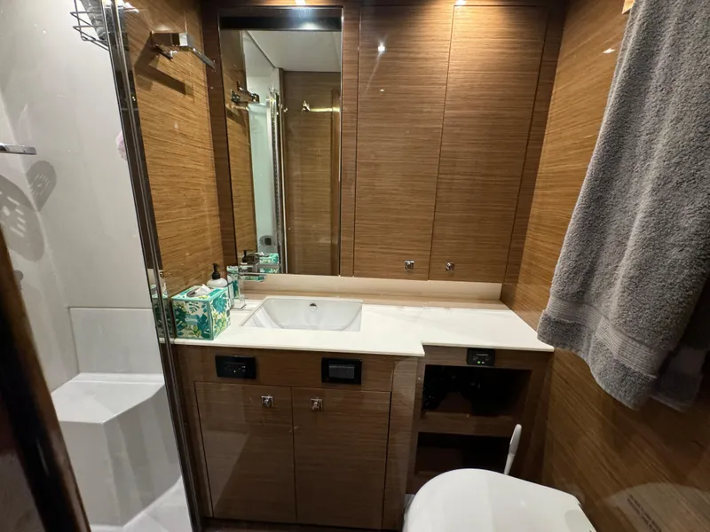 Slide: The Image of Luxurious bathroom in 2018 Cruisers Yachts 50 Cantius with modern fixtures and wood paneling. - 23