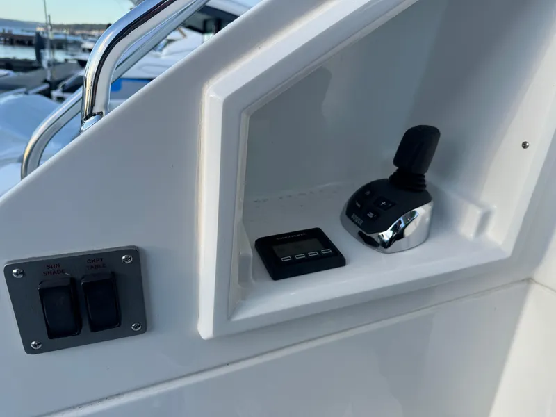 Slide: The Image of Control panel of 2018 Cruisers Yachts 50 Cantius with joystick and switches. - 6