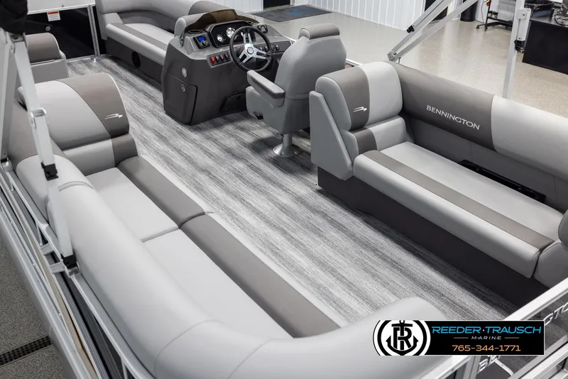Slide: The Image of 2025 Bennington 23 SSRSE pontoon boat interior with gray seating and modern dashboard. - 11