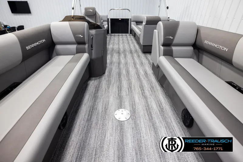 Slide: The Image of 2025 Bennington 23 SSRSE pontoon boat interior with gray seating and carpet flooring. - 13