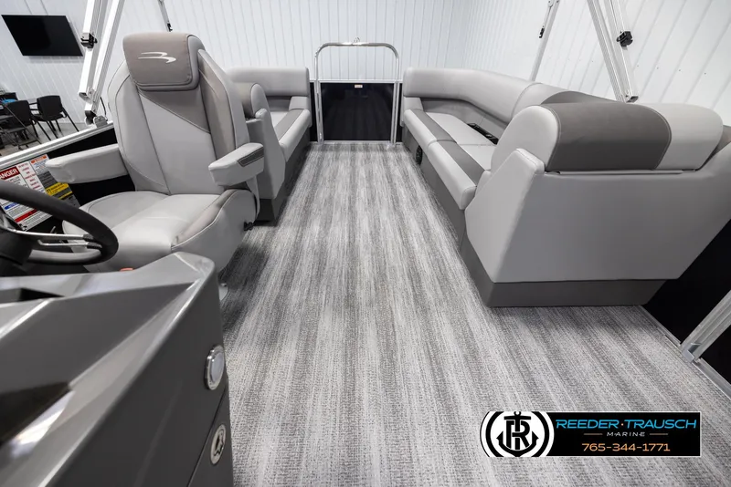 Slide: The Image of Interior of 2025 Bennington 23 SSRSE pontoon boat with gray seating and modern design. - 14