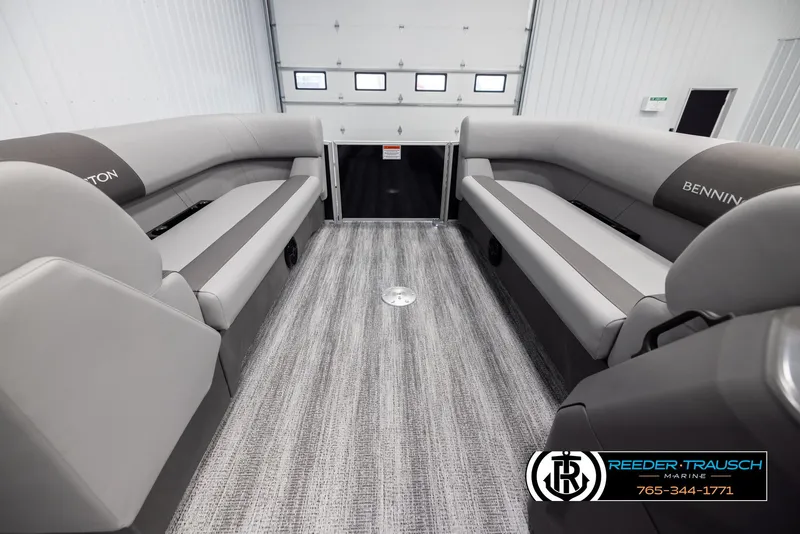 Slide: The Image of 2025 Bennington 23 SSRSE pontoon boat interior with gray seating and flooring. - 18
