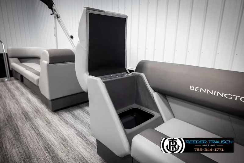 Slide: The Image of 2025 Bennington 23 SSRSE boat interior with open storage compartment and seating. - 22