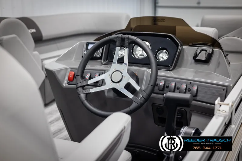 Slide: The Image of Steering console of 2025 Bennington 23 SSRSE pontoon boat with modern controls. - 25