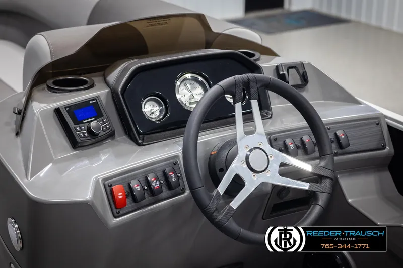 Slide: The Image of 2025 Bennington 23 SSRSE boat dashboard with steering wheel and control panel. - 26
