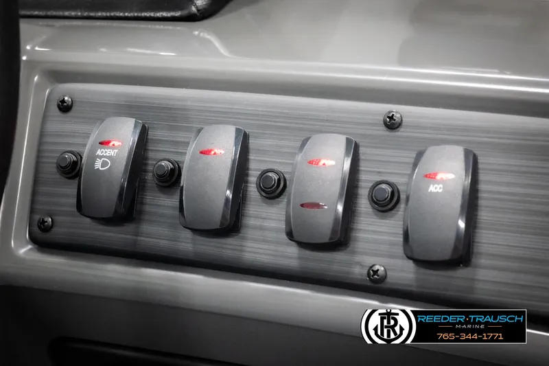 Slide: The Image of Control panel of 2025 Bennington 23 SSRSE boat with labeled switches and buttons. - 32