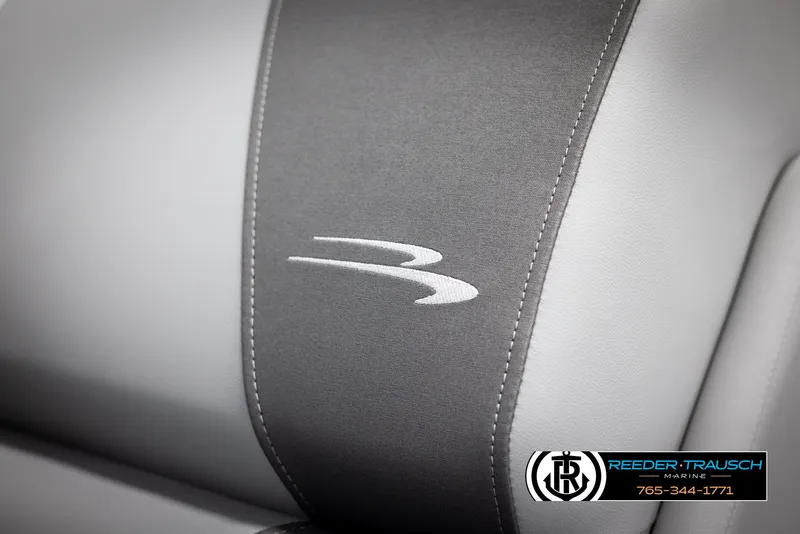 Slide: The Image of 2025 Bennington 23 SSRSE boat seat with logo, featuring gray and white upholstery. - 36