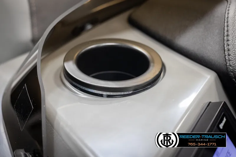 Slide: The Image of 2025 Bennington 23 SSRSE cup holder detail with Reeder-Trausch Marine logo. - 37