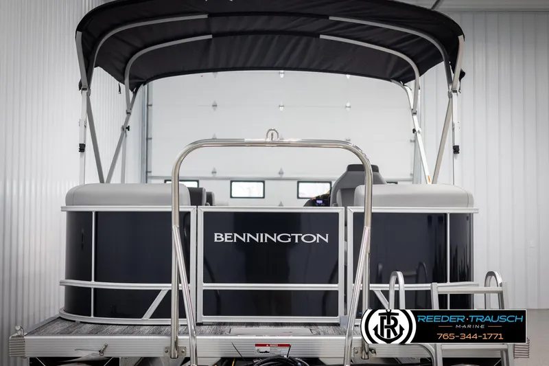 Slide: The Image of 2025 Bennington 23 SSRSE pontoon boat with canopy in a showroom. - 7