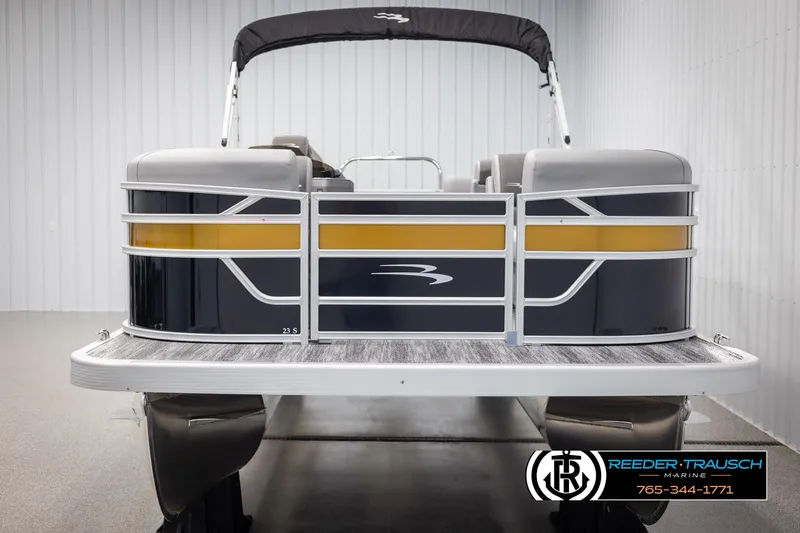 Slide: The Image of 2025 Bennington 23 SSRSE pontoon boat in showroom, featuring sleek design and modern amenities. - 8