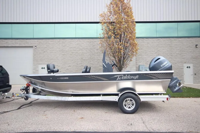 The Image of 2025 Weldcraft 200 Rebel Open boat with F150hp engine on trailer. - 0