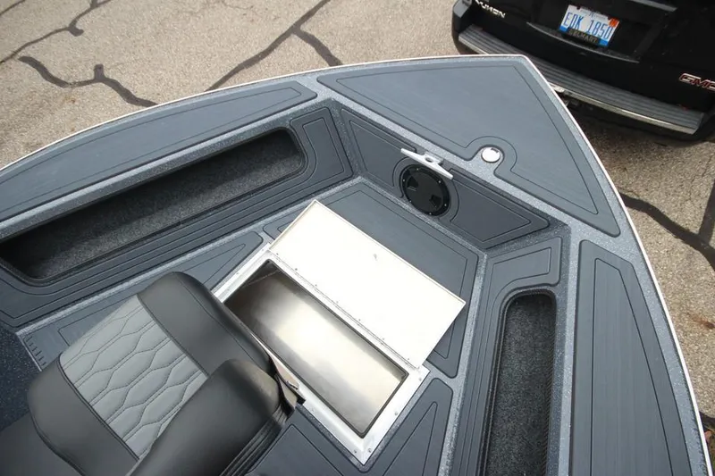 Slide: The Image of 2025 Weldcraft 200 Rebel boat interior with storage compartments and seating. - 10