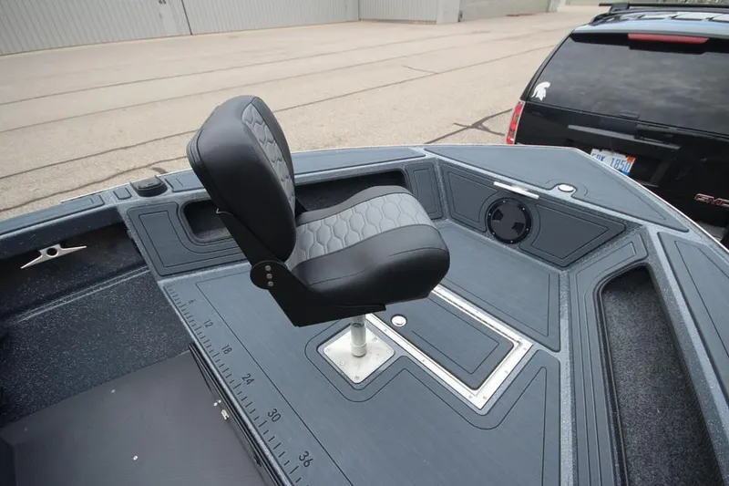 Slide: The Image of 2025 Weldcraft 200 Rebel boat interior with swivel seat and measurement markings. - 11