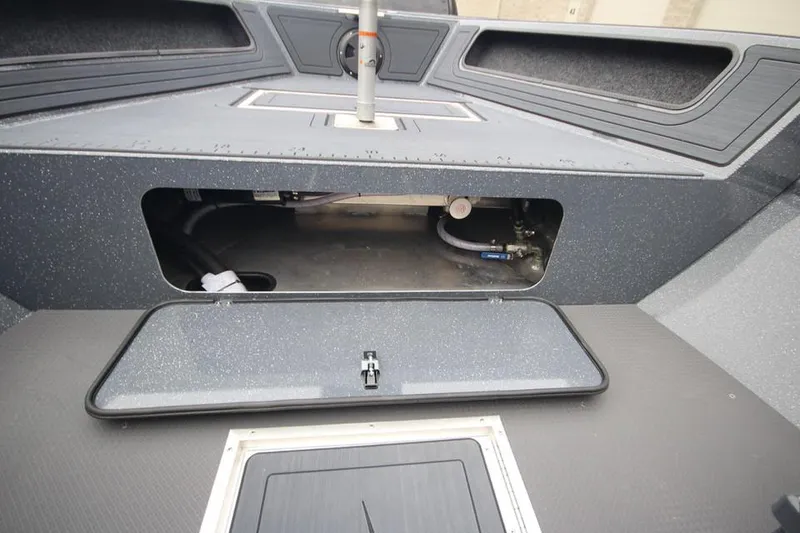 Slide: The Image of 2025 Weldcraft 200 Rebel Open boat storage compartment, showcasing interior design and functionality. - 13
