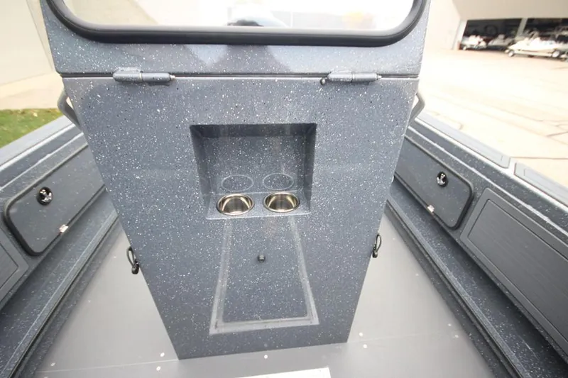 Slide: The Image of 2025 Weldcraft 200 Rebel boat interior with cup holders and storage compartments. - 16