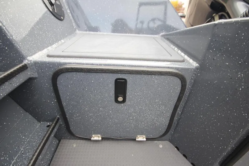 Slide: The Image of 2025 Weldcraft 200 Rebel boat interior storage compartment, sleek design, durable finish. - 22
