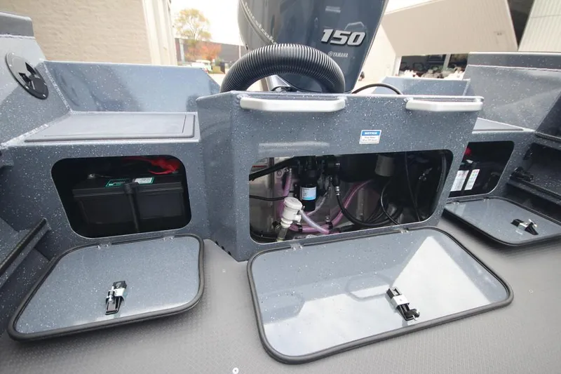 Slide: The Image of 2025 Weldcraft 200 Rebel Open boat with F150hp engine, showcasing storage compartments. - 23